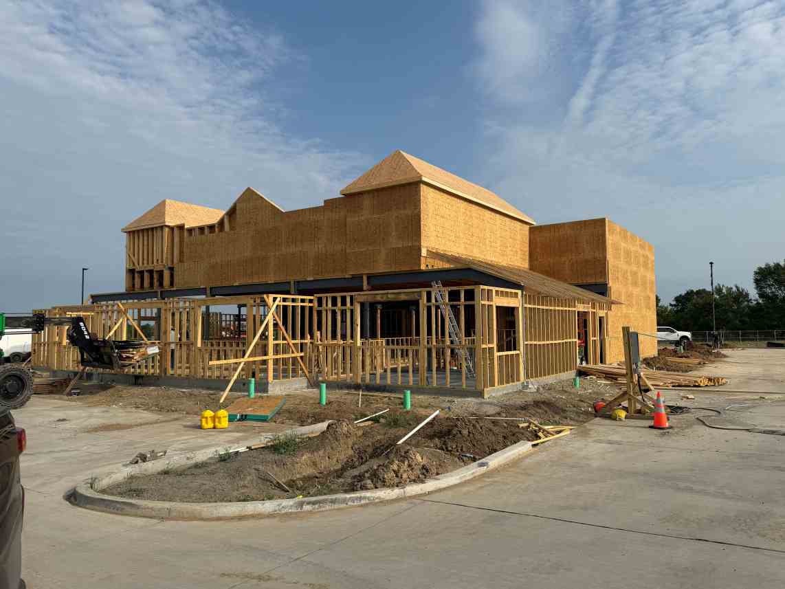 Commercial building under construction with wood framing and exterior sheathing